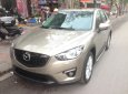 Cần bán xe Mazda CX-5, sản xuất và đăng ký 2013 mầu vàng cát. Giá 665 triệu