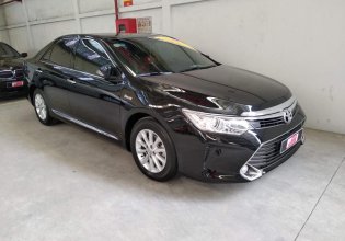 Cần bán xe Toyota Camry E 2015, màu đen, xe cực đẹp, giá thương lượng giá 920 triệu tại Tp.HCM