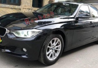 Cần bán xe BMW 320i sản xuất 2012, model 2013 màu đen giá 720 triệu tại Hà Nội