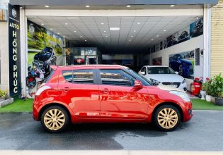 Cần bán xe Suzuki Swift 1.4 AT năm 2014, màu đỏ giá 379 triệu tại Tp.HCM