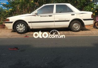 Bán Mazda 323 MT năm sản xuất 1996, màu trắng số sàn, giá tốt giá 59 triệu tại Tp.HCM