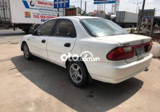 Bán Mazda 323 MT sản xuất 2000, màu trắng giá 75 triệu tại Tiền Giang