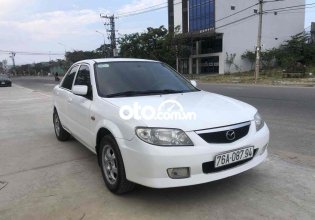 Cần bán lại xe Mazda 323 sản xuất năm 2004, màu trắng giá 135 triệu tại Quảng Nam